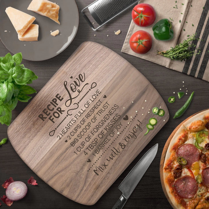 In Use Engraved recipe cutting boards in natural walnut brown, featuring 20 kitchen recipe designs by ARTFULANE