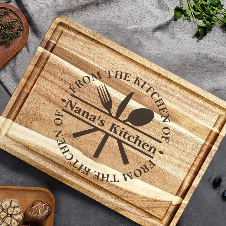 Custom kitchen monogram engraved cutting boards featuring utensils, scrolls, and name designs in walnut and maple wood by ARTFULANE