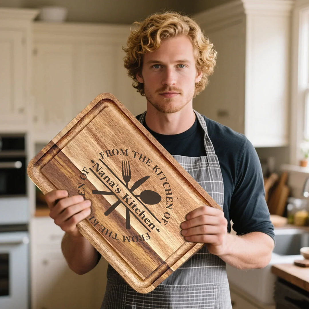 Man holding Custom kitchen monogram engraved cutting boards featuring utensils, scrolls, and name designs in walnut and maple wood by ARTFULANE