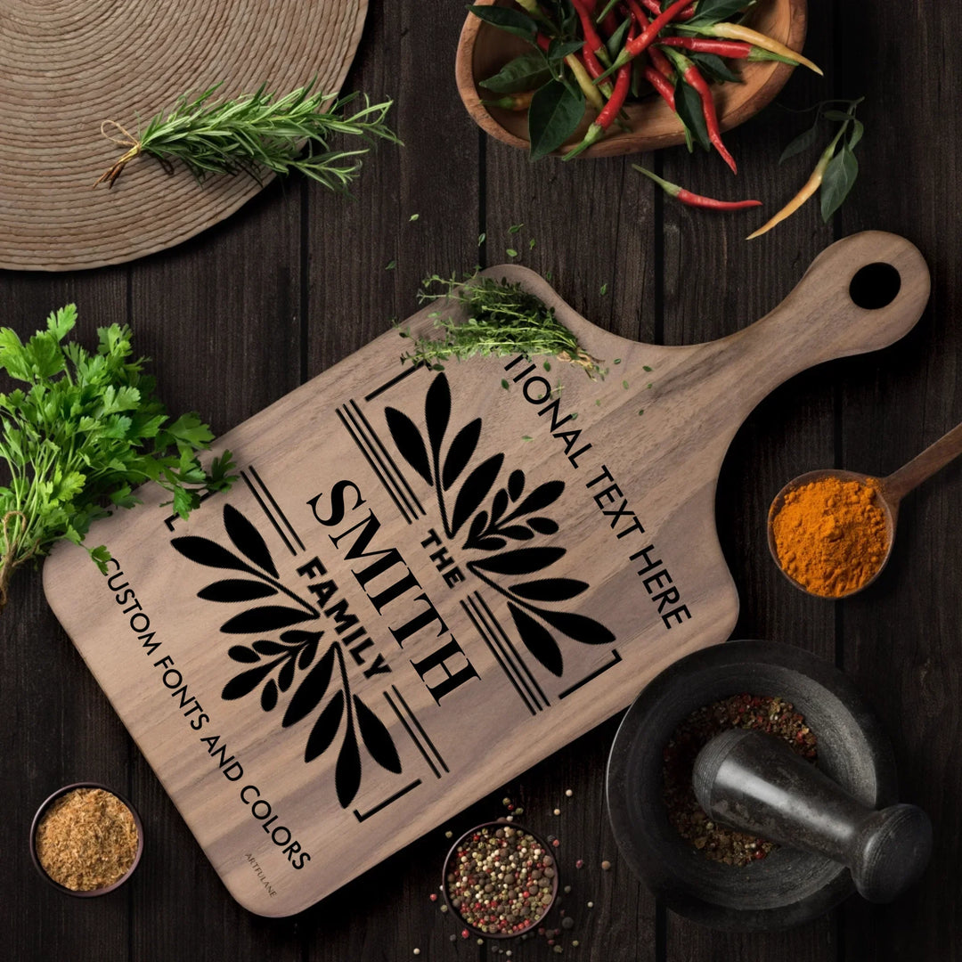 Personalized kitchen cutting board engraved with family monogram and optional top or bottom text, crafted from walnut and maple hardwood by ARTFULANE