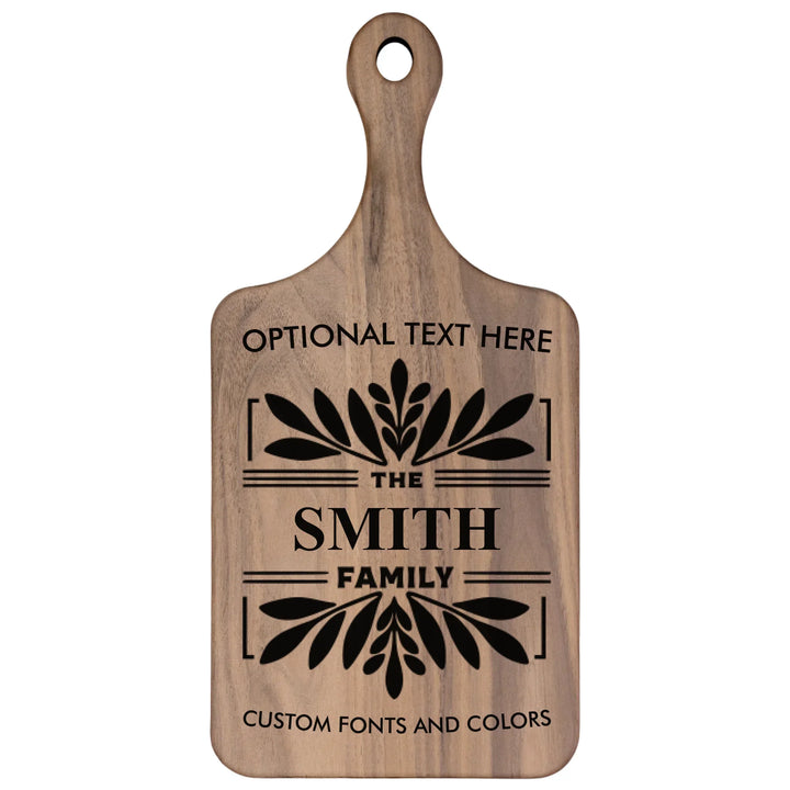 Personalized kitchen cutting board engraved with family monogram and optional top or bottom text, crafted from walnut and maple hardwood by ARTFULANE