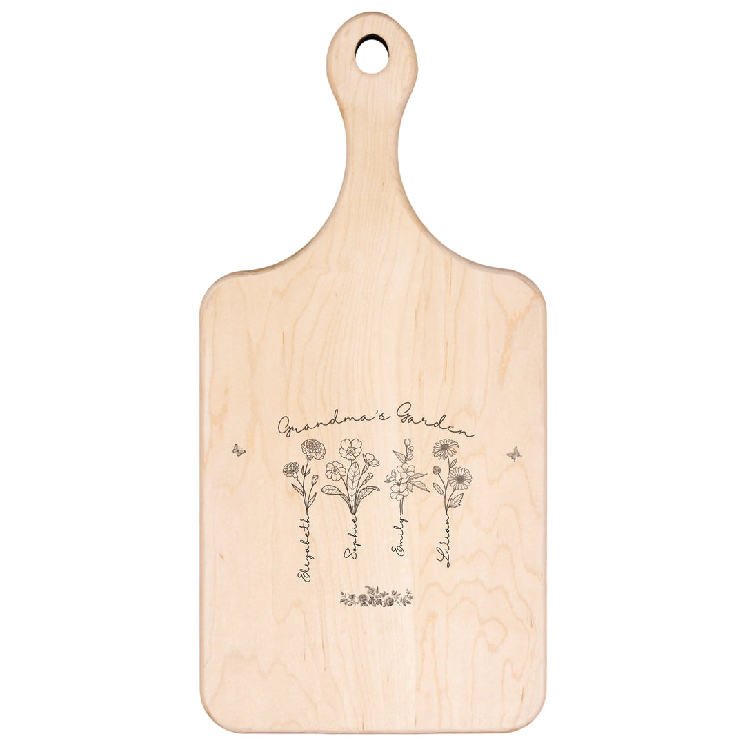 Engraved wooden cutting boards with line art birth month flowers and custom family names in natural maple or walnut finishes by ARTFULANE