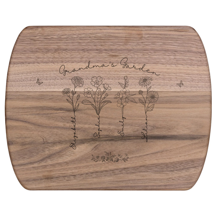 Engraved wooden cutting boards with line art birth month flowers and custom family names in natural maple or walnut finishes by ARTFULANE