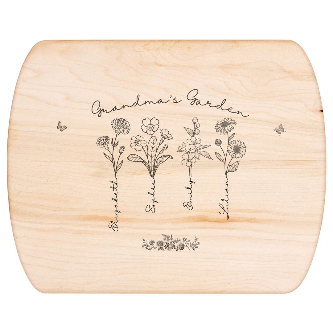 Engraved wooden cutting boards with line art birth month flowers and custom family names in natural maple or walnut finishes by ARTFULANE