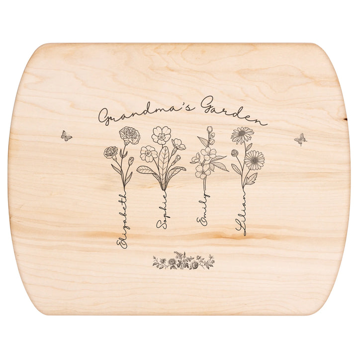 Engraved wooden cutting boards with line art birth month flowers and custom family names in natural maple or walnut finishes by ARTFULANE