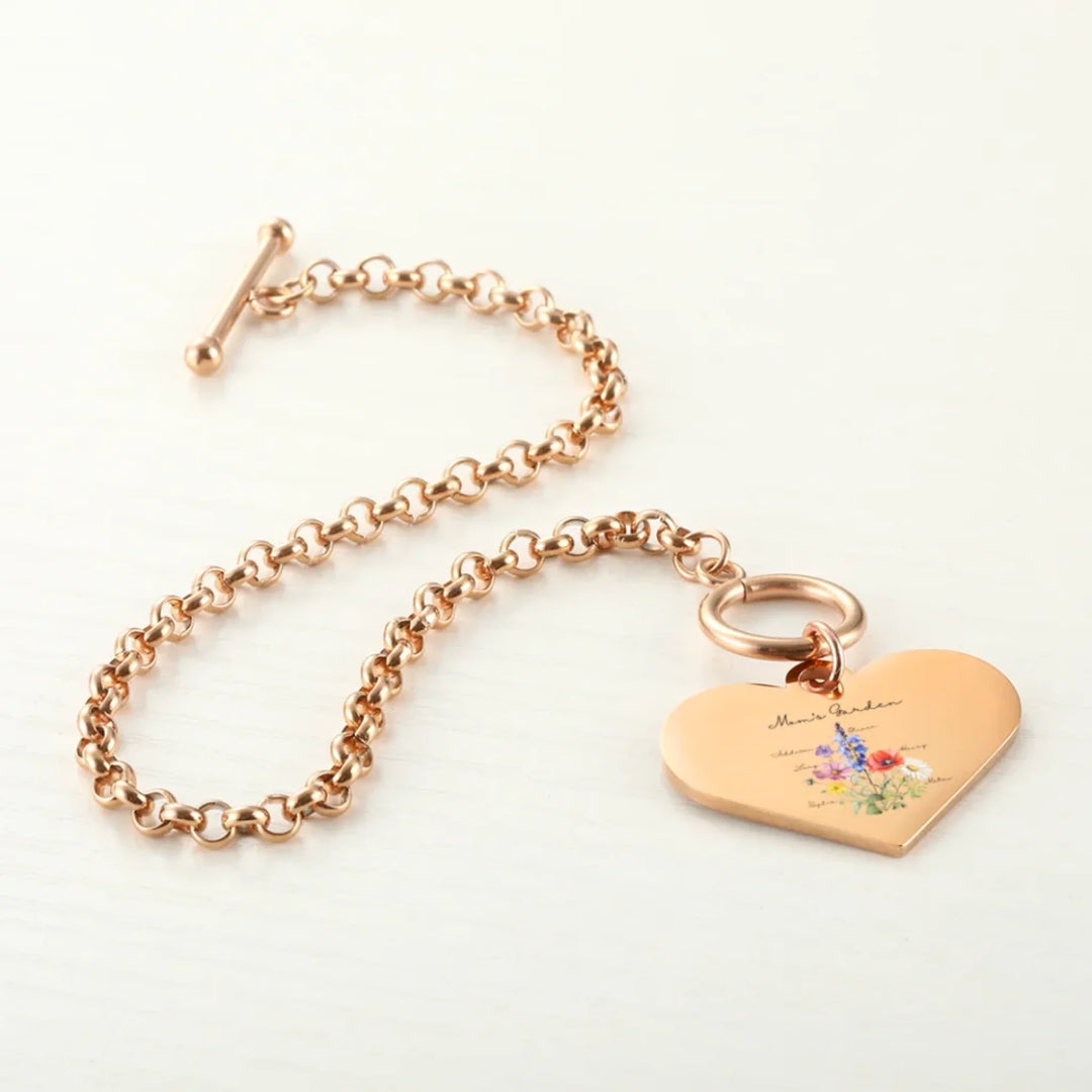 Custom-Birth-Month-Flower-Bouquet-Heart-Bracelet-on-table-artfulane