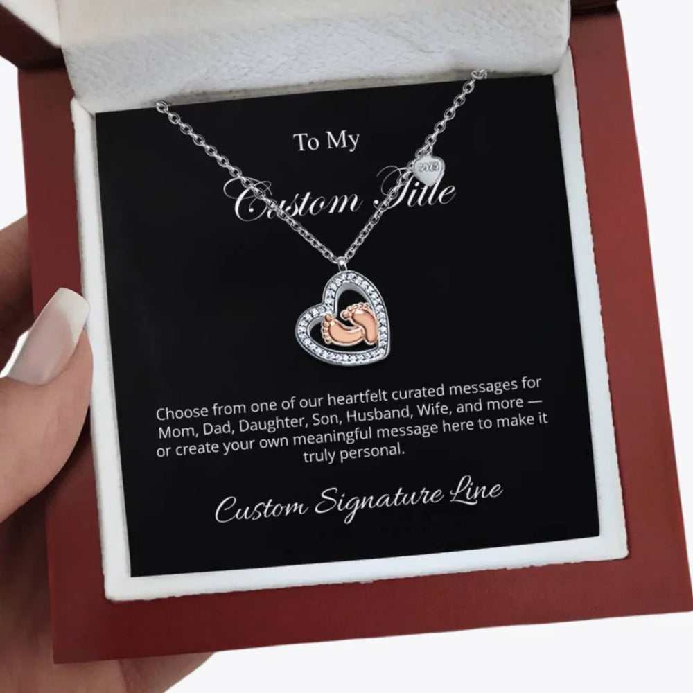 Baby-Feet-Heart-Necklace-in-hand-artfulane