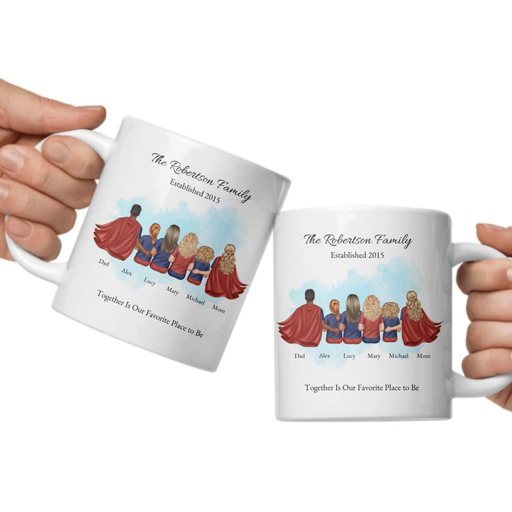 Personalized superhero family mug with matching outfits and names, seated back view -ceramic mugs both sides in hands-ARTFULANE