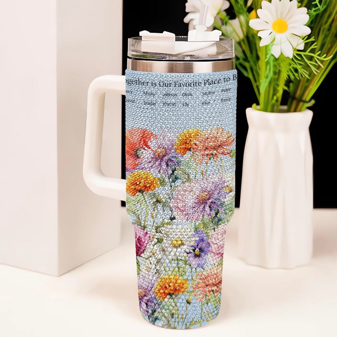 Custom 40oz rhinestone tumbler with handle in personalized birth month flower garden design, insulated stainless steel cup with lid and straw on table-ARTFULANE