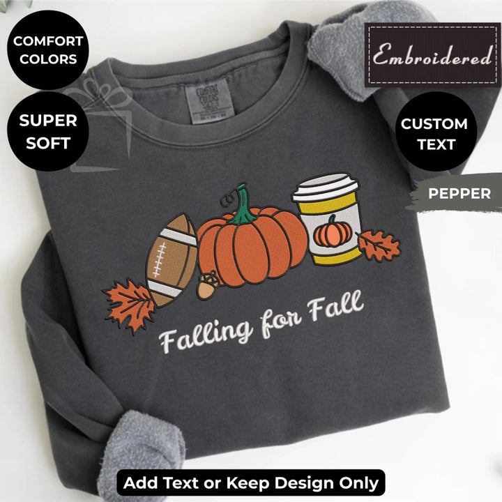 Fall Football Sweatshirt in pepper – Comfort Colors embroidered crewneck with pumpkin, football, and coffee design, customizable text option-ARTFULANE