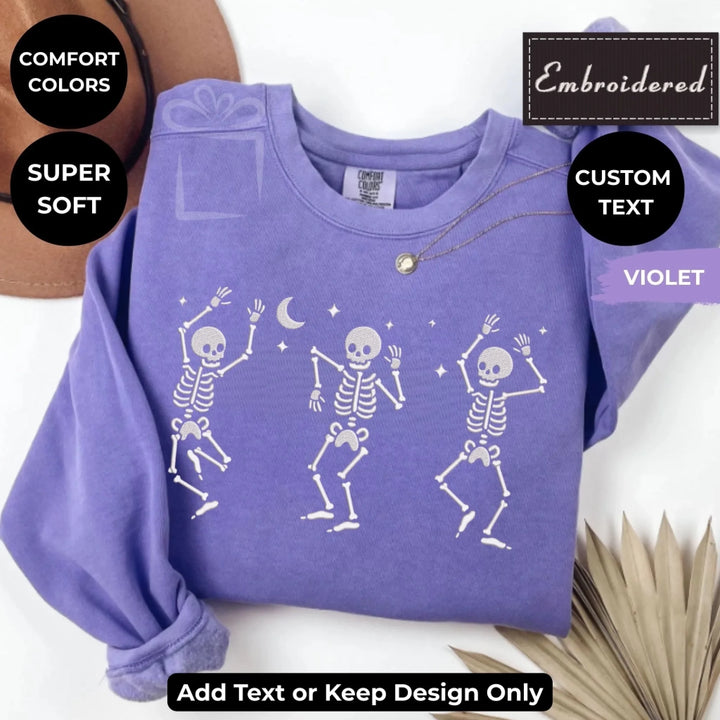 Dancing Skeletons Embroidered Sweatshirt in VIOLET Comfort Colors – Customizable spooky design, unisex fit, available in 15 colors-ARTFULANE