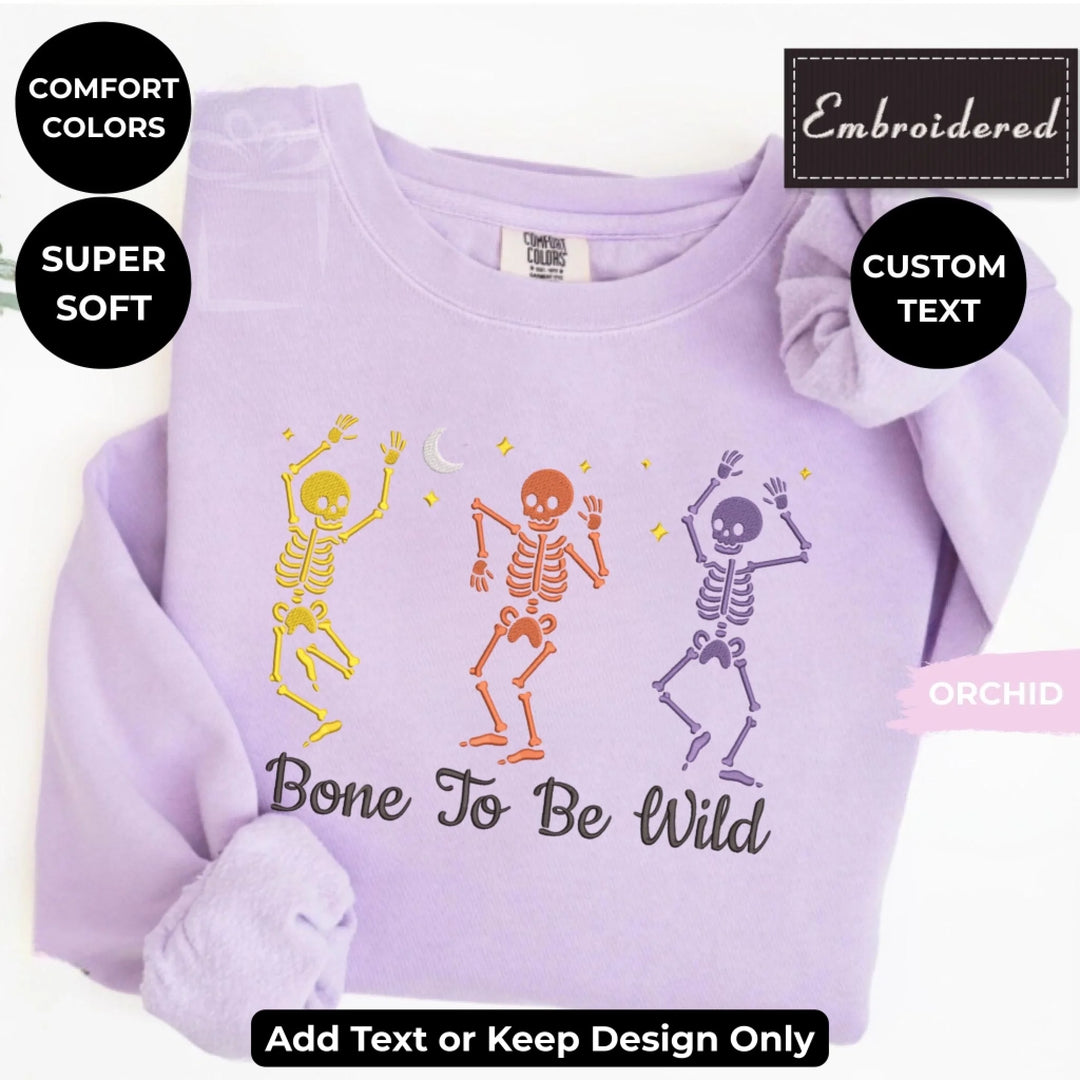 Dancing Skeletons Sweatshirt in ORCHID – Comfort Colors embroidered crewneck with skeleton design, customizable text option-ARTFULANE