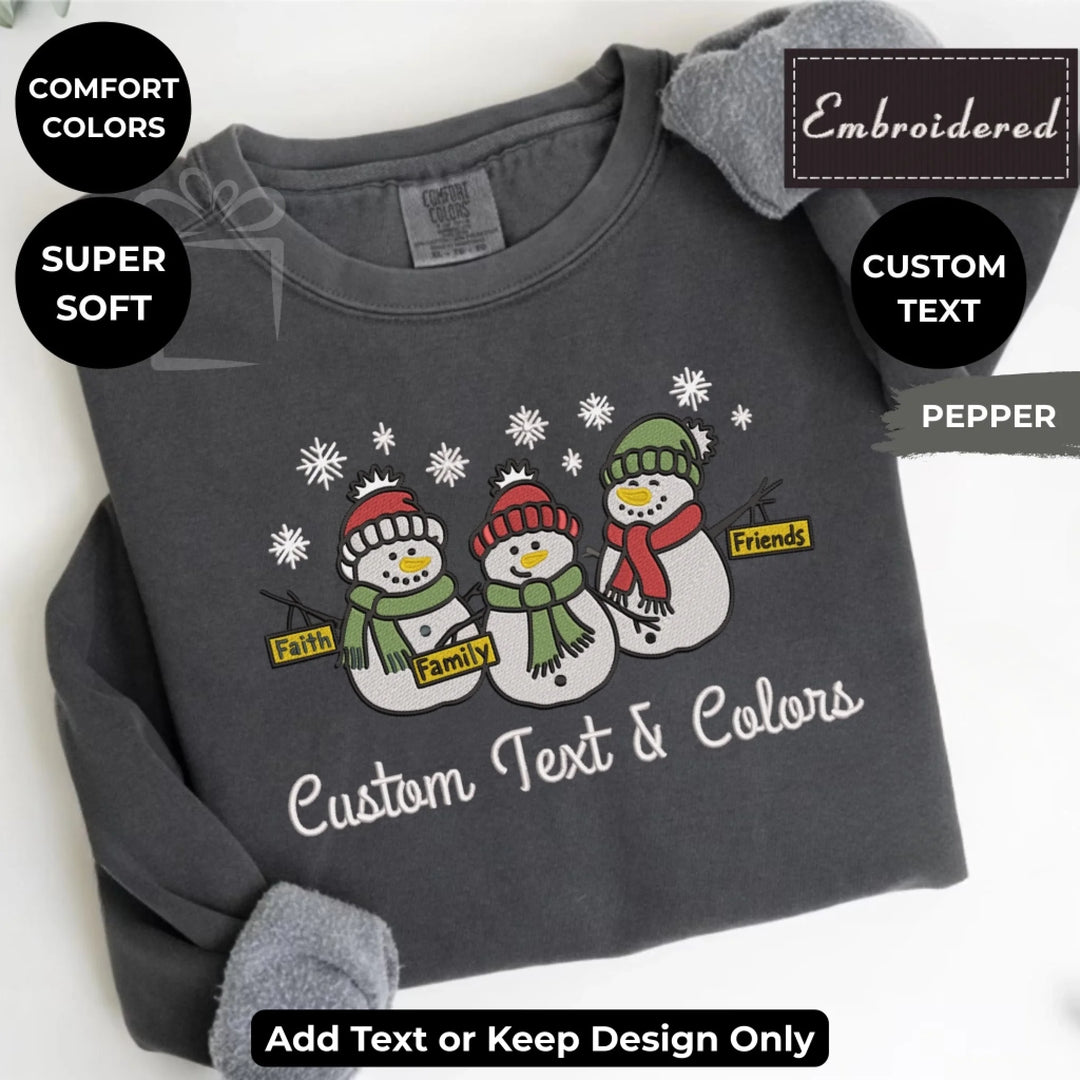 Comfort Colors sweatshirt featuring trio snowmen Faith Family Friends embroidered design – customizable holiday crewneck-ARTFULANE