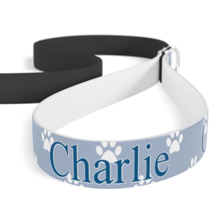 Closeup of Personalized paws print pet leash with custom text like a name. Available in different paw print colors for dogs or cats-ARTFULANE