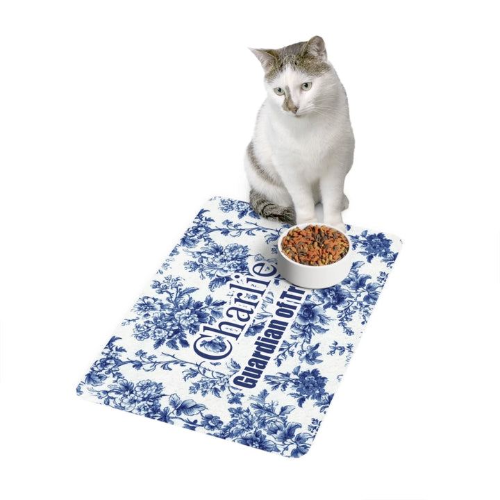 Cat using Personalized French Country Blue Toile de Jouy pet feeding mat with custom text like a name. Available in different Toile de Jouy patterns for dogs or cats-ARTFULANE