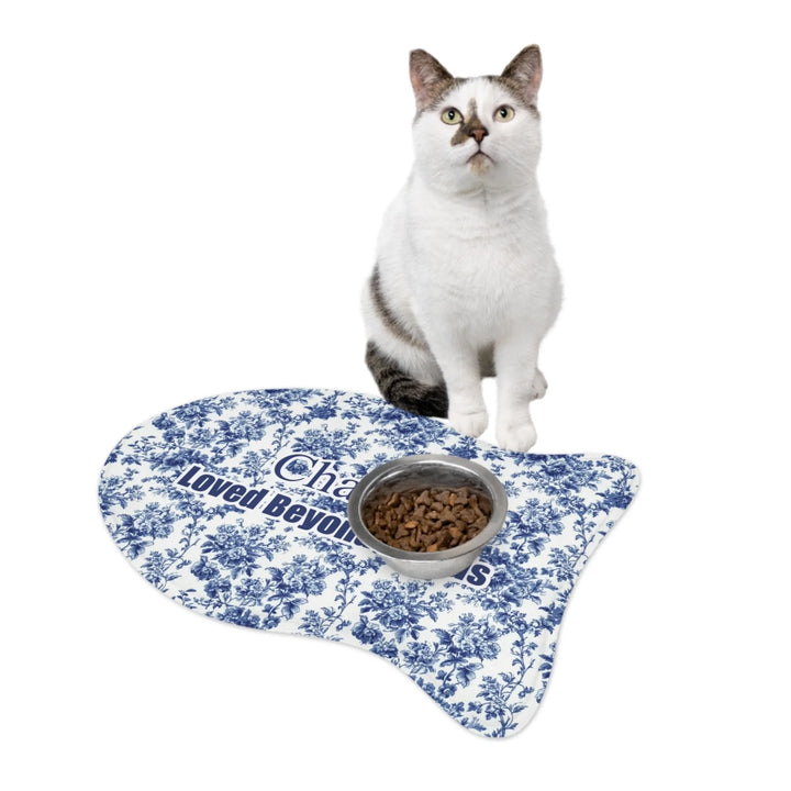 Cat using Personalized French Country Blue Toile de Jouy pet fish-shaped feeding mat with custom text like a name. Available in different Toile de Jouy patterns for dogs or cats-ARTFULANE