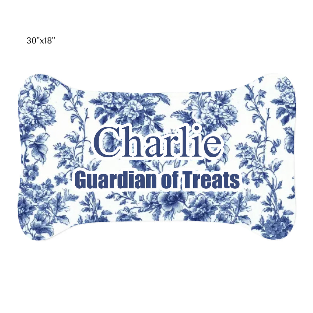 Cat using Personalized French Country Blue Toile de Jouy pet bone-shaped feeding mat with custom text like a name. Available in different Toile de Jouy patterns for dogs or cats-ARTFULANE