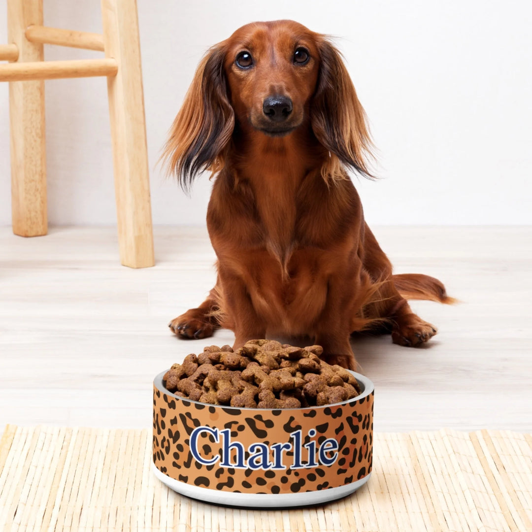 Dog using Personalized Animal Print pet stainless steel bowl with custom text like a name. Available in different animal print colors (leopard, cow, snake, crocodile, cheetah, dalmatian, giraffe, zebra, tiger, scales) for dogs or cats-ARTFULANE