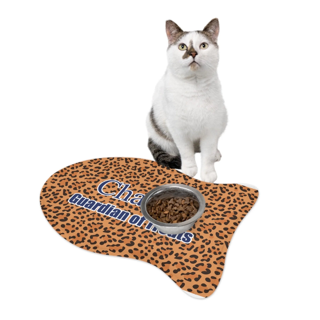 Cat using Personalized Animal Print pet fish-shaped feeding mat with custom text like a name. Available in different animal print colors (leopard, cow, snake, crocodile, cheetah, dalmatian, giraffe, zebra, tiger, scales) for dogs or cats-ARTFULANE