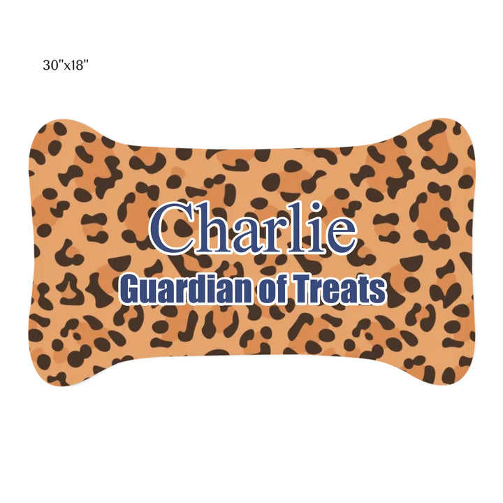 Personalized Animal Print pet bone-shaped feeding mat with custom text like a name. Available in different animal print colors (leopard, cow, snake, crocodile, cheetah, dalmatian, giraffe, zebra, tiger, scales) for dogs or cats-ARTFULANE