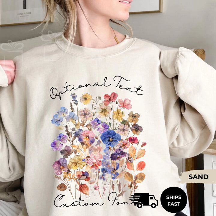 Personalized ‘This Mama Loves Her Blessings’ Gildan sweatshirt or hoodie, featuring custom kids names printed below gift box icons on the sleeve — cozy unisex holiday apparel for moms or grandmas-ARTFULANE