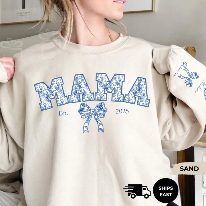 Personalized ‘This Mama Loves Her Blessings’ Gildan sweatshirt or hoodie, featuring custom kids names printed below gift box icons on the sleeve — cozy unisex holiday apparel for moms or grandmas-ARTFULANE