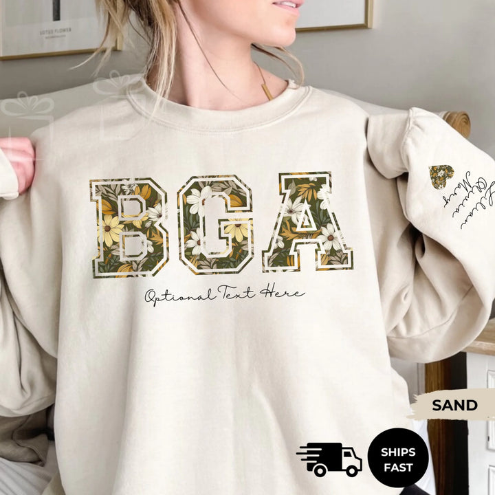 Personalized ‘This Mama Loves Her Blessings’ Gildan sweatshirt or hoodie, featuring custom kids names printed below gift box icons on the sleeve — cozy unisex holiday apparel for moms or grandmas-ARTFULANE