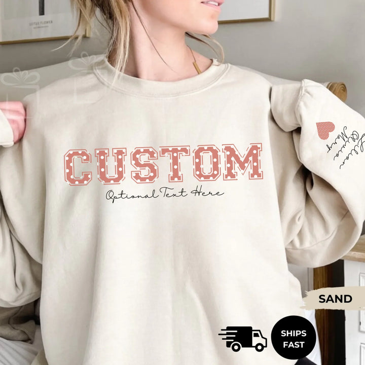 Personalized ‘This Mama Loves Her Blessings’ Gildan sweatshirt or hoodie, featuring custom kids names printed below gift box icons on the sleeve — cozy unisex holiday apparel for moms or grandmas-ARTFULANE