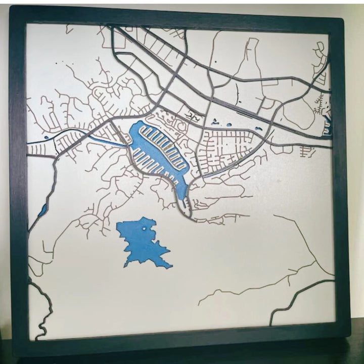 Custom engraved text on the back of a layered wooden map, personalized with names, city, coordinates and date-ARTFULANE