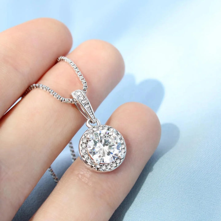Cubic-Zirconia-eternal-hope-Necklace-in-hand-artfulane