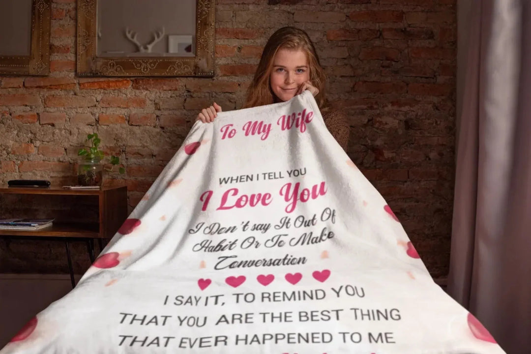 to-my-wife-throw-blanket-mockup-featuring-a-girl-sitting-on-a-bed-24677
