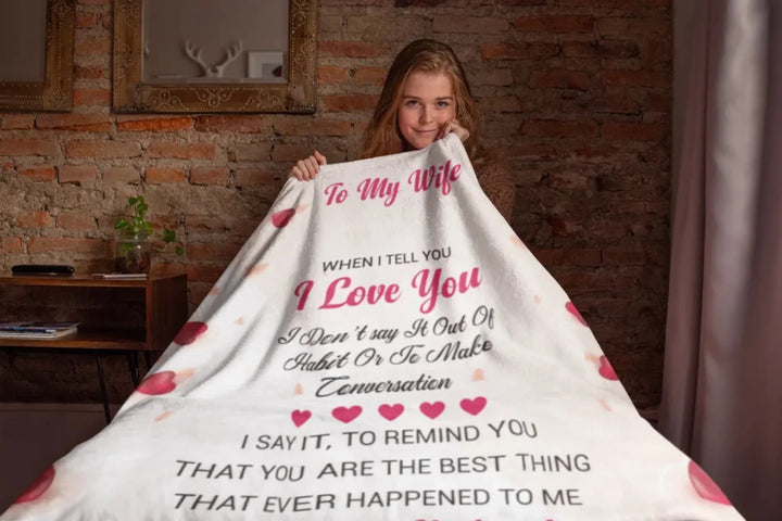 to-my-wife-throw-blanket-mockup-featuring-a-girl-sitting-on-a-bed-24677